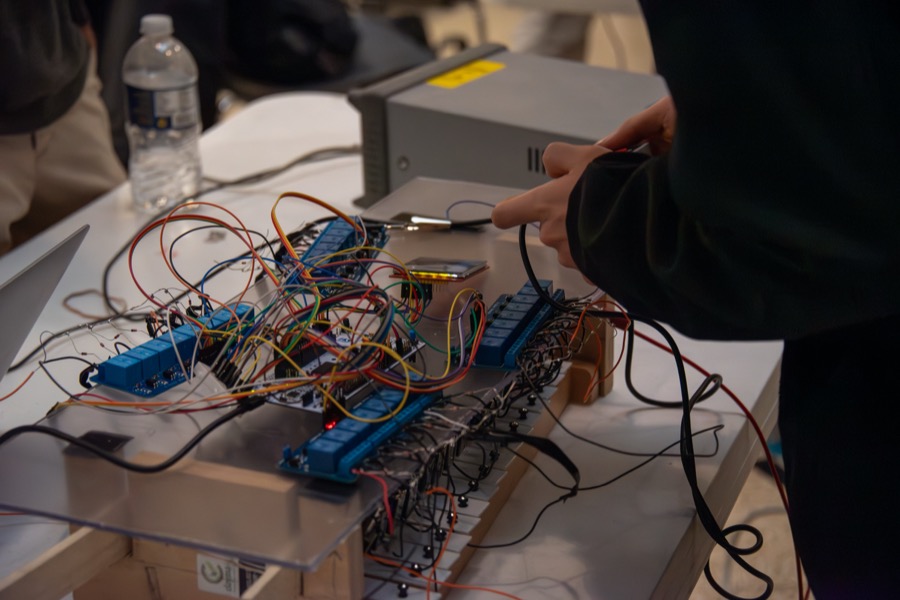 Teams demonstrating their projects at the EECS 373 Embedded System Expo, photo 4